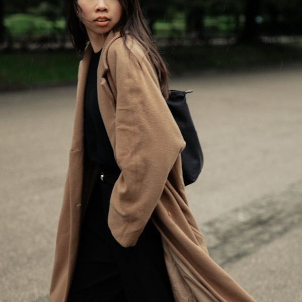 Man in a calm, focused state after a workout, looking out a window.
